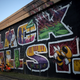 Children pose for a photo in front of a mural marking Black Wall Street, also called the Greenwood Distric, June 18, 2020 in Tulsa, Oklahoma. The Black Wall Street Massacre happened in 1921 and was one of the worst race riots in the history of the United States where more than 35 square blocks of a predominantly black neighborhood were destroyed in two days of rioting leaving between 150-300 people dead.